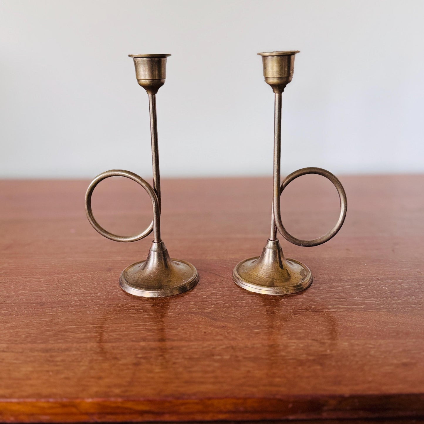 Pair of Mid-Century Modern Brass Trumpet Loop Candlesticks – 7.5” Sculptural Taper Holders